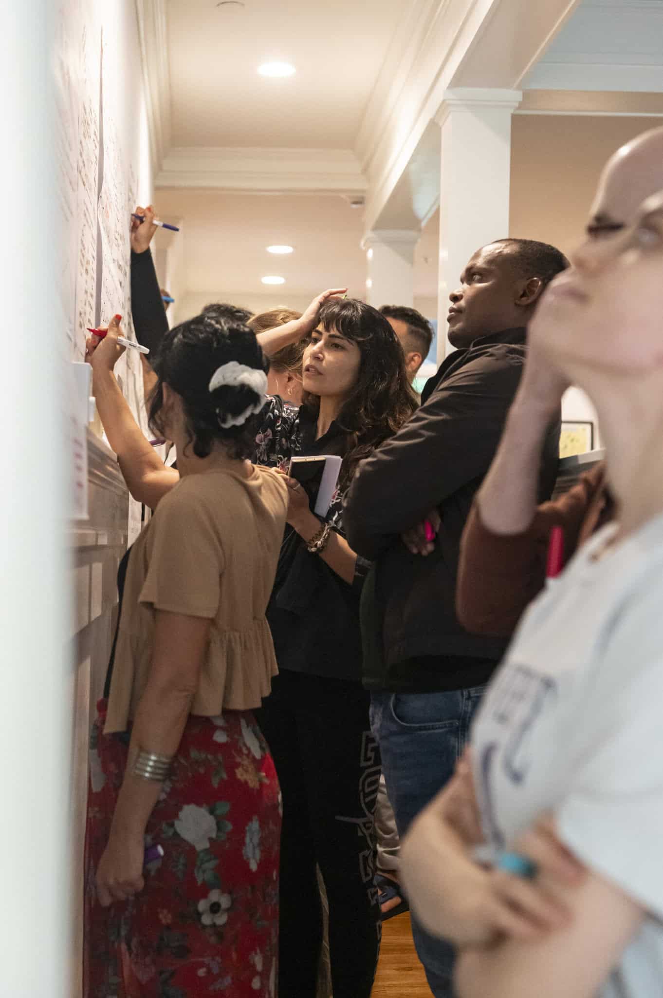 Yaela, Felix and Naysa working on posters